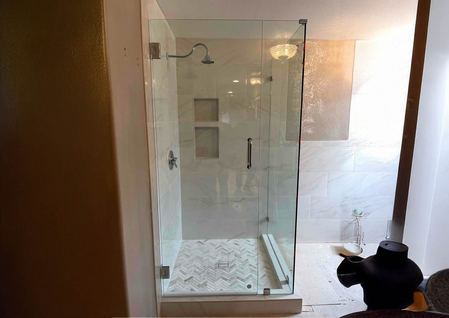 Frameless shower door installed by Glass West